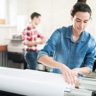 woman-loading-wide-format-printer-TCPVNAJ.jpg woman-loading-wide-format-printer-TCPVNAJ.jpg
